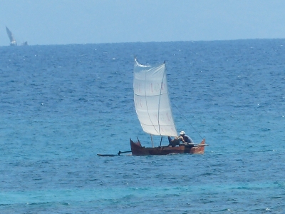 Outrigger canoe with sail